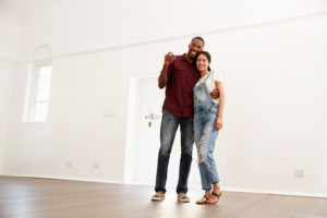 Portrait of Couple Moving Into New Home Together